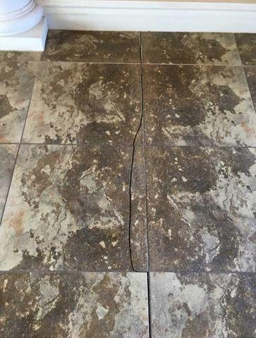 Sometime the floor cracks will also crack floor tiles.  Floor cracks are a symptom of a foundation problem.