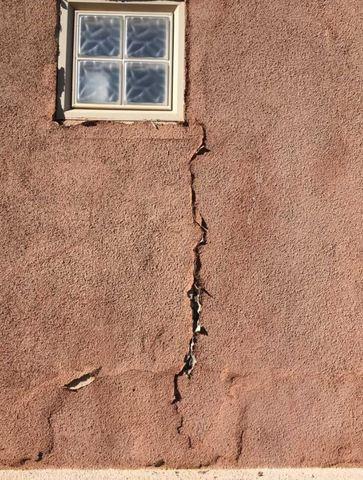 This photo clearly illustrates a series of exterior wall cracks.  Wall cracks like this indicate foundation movement.