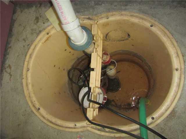 Triple Safe Sump Pump Being Cleaned Out