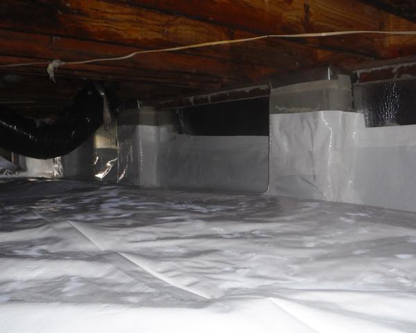 With the encapsulation system in place the crawl space is protected from water vapor entering the home from the Earth's ground.