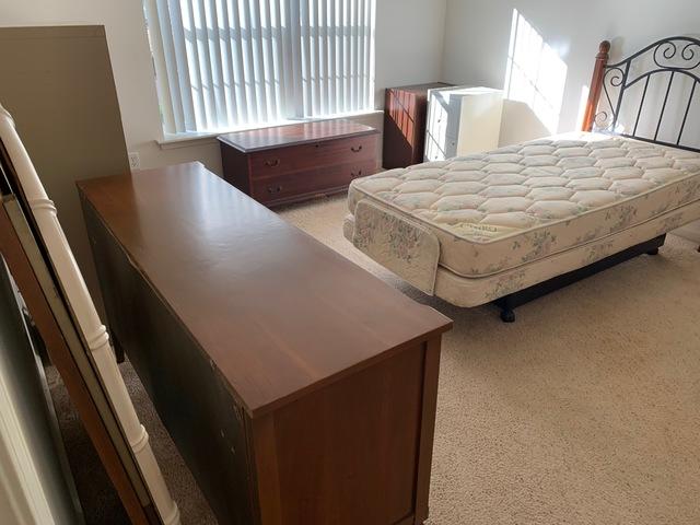This bedroom set including dresser, bed frame, mattress, and end tables all needs to be removed from the home.