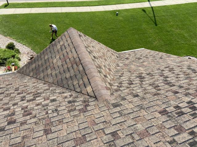 This roof shows granule loss. This is a normal aging process, but it is a sign a new roof may be needed soon. Granules protect the asphalt shingle structures from the elements.