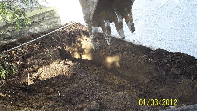 First step to installing the Push Pier system is to remove soil down to the foundation footing.