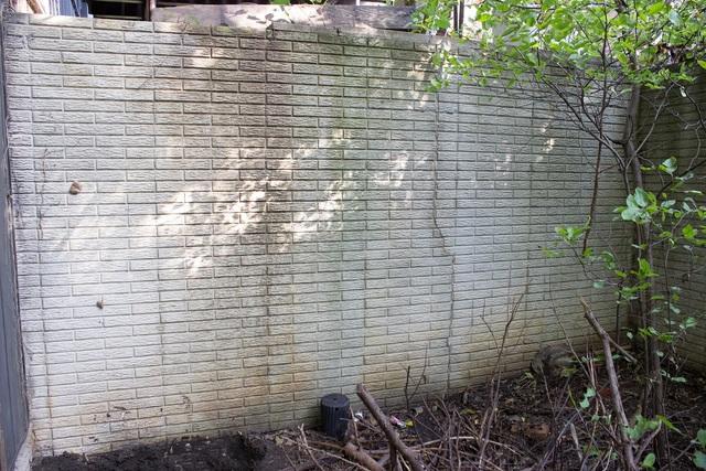 <p>This photo shows the effect the street creep has taken on the wall. You can again see the fracturing at the bottom of the wall.</p>