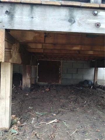 Before Pic of the Crawlspace Entrance