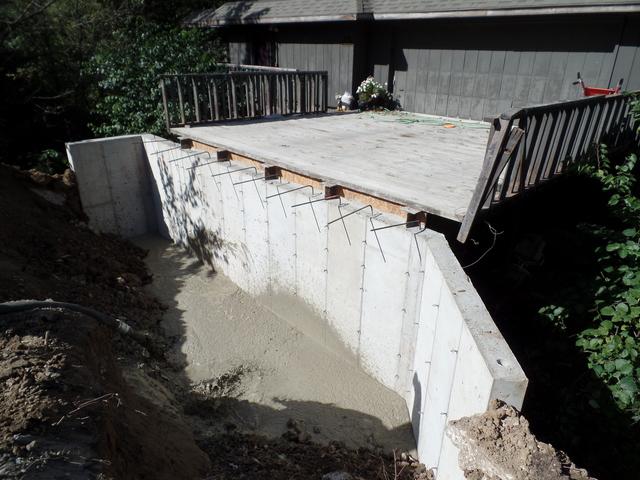 Another view of the retaining wall being completed.