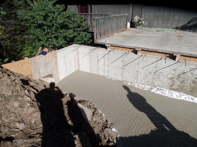 Filling the void with newly poured concrete.