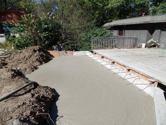 Newly poured concrete is shown here filling the void.