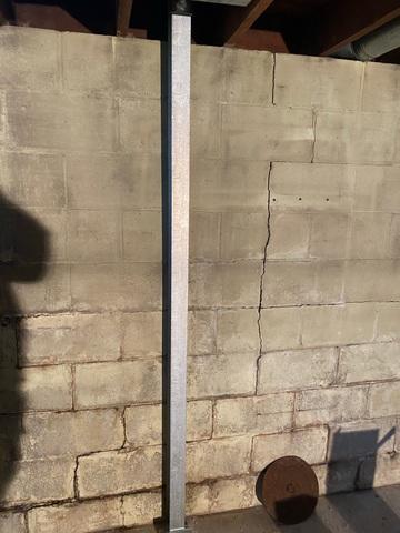 Cracked and Bowing Foundation Walls Stabilized With A Custom Solution From DBS
