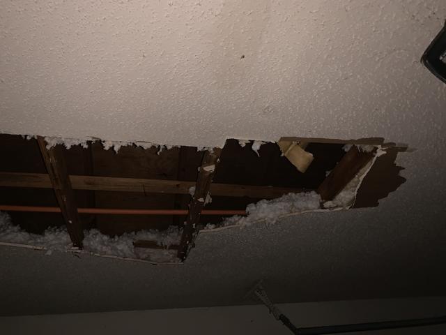 This shows the water damaged ceiling where the pipes burst.