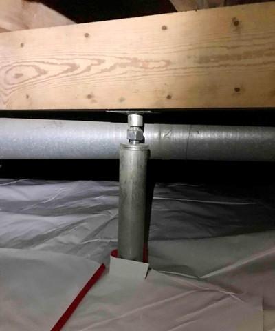 SmartJack installed to stabilize the sagging floor joists in the crawl space.