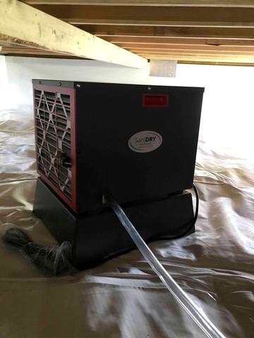 Energy-efficient SaniDry Sedona dehumidifier installed to control the environment in the crawl space