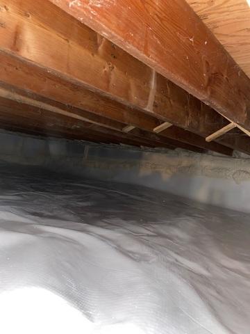 This photo shows an encapsulated crawlspace. No more musty odors, cold floors, or high energy bills!