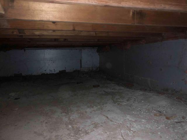 This photo shows a damp and musty crawlspace. We have the solution to encapsulate this!