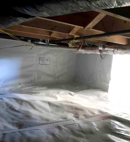 CleanSpace vapor barrier installed to prevent moisture from passing through the crawl space ground and walls