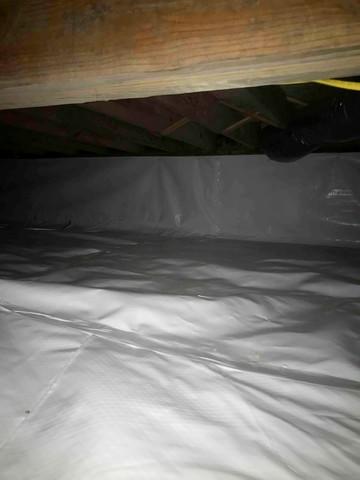 CleanSpace vapor barrier installed to prevent moisture from passing through the crawl space ground and walls