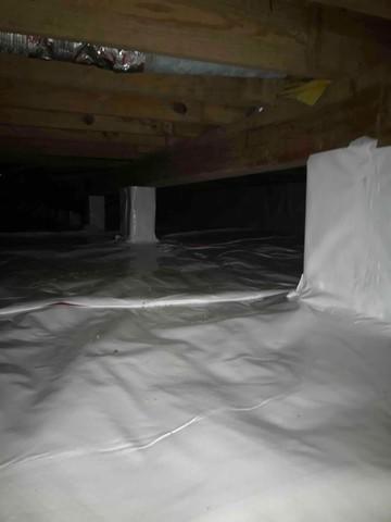 CleanSpace vapor barrier installed to prevent moisture from passing through the crawl space ground and walls