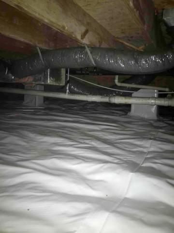 CleanSpace vapor barrier installed to prevent moisture from passing through the crawl space ground and walls