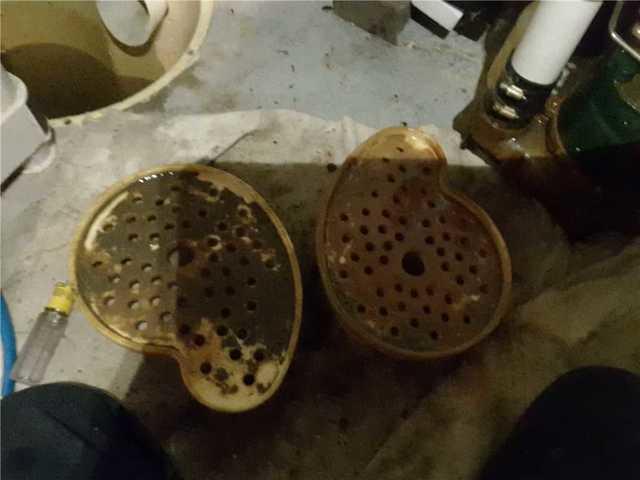 Here are the Triple Safe Sump Pump stands before being cleaned out. It shows how much dirt and grim the sump pump collects throughout the months when it pumps water away from the basement.