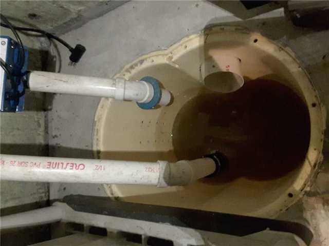 Here is the Triple Safe Sump Pump System before it is maintained. Over time, the system collects dirt and grime from pumps out gallons of water. By maintaining the system, it will never clog and develop serious issues.