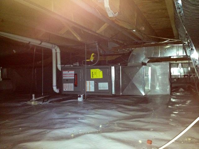 <p>Here is the crawl after our work was done. The moldy, damaged fiberglass has been completely removed. The entire floor has been encapsulated with a CleanSpace liner. The furnace has been replaced with a high-effeciency model and is properly leveled. Much cleaner, much more comfortable.</p>