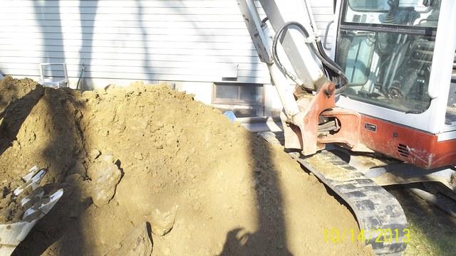 First step to installation, is to remove the soil around where to new window and RockWell will be 