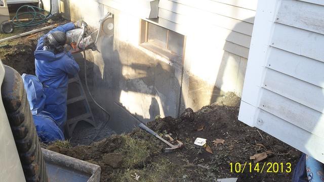 A section of the foundation wall is then cut into and removed