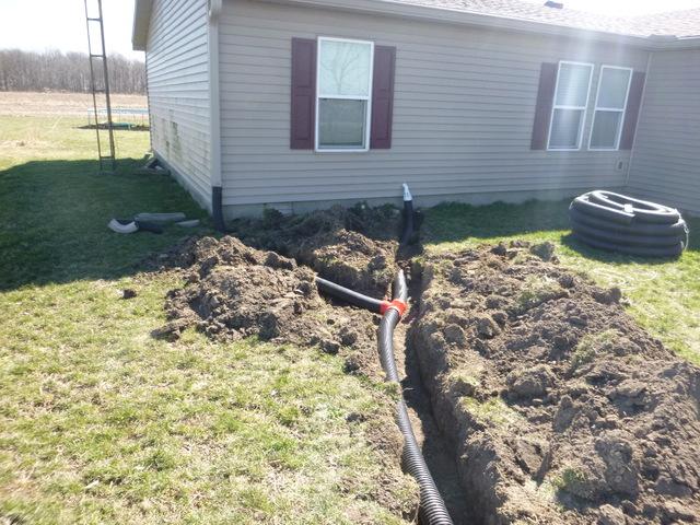 We buried the discharge lines for the sump pumps and ran them ninety feet away from the property.