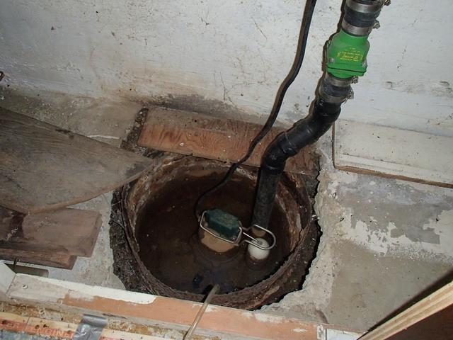 The previous owners installed this sump pump, but during heavy rains it would overflow and flood the basement.