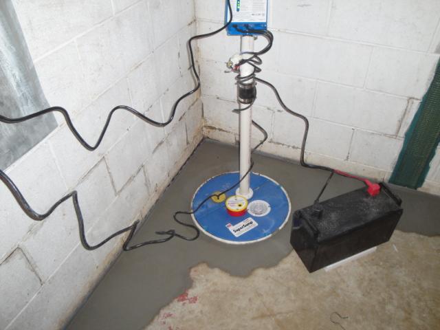 WaterGuard is designed to drain cinderblocks of water and to push water into a sump pump.  Here we have installed an UltraSump pump to discharge the water from the perimeter drain.