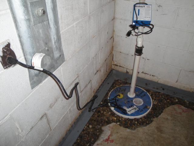 WaterGuard is designed to drain cinderblocks of water and to push water into a sump pump.  Here we have installed an UltraSump pump to discharge the water from the perimeter drain.