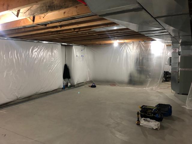 <p>Early in the installation process, the basement is being prepped for the framework for the EverLast Wall Panels that will be installed around the exterior of the finished area of the basement as well as to divide the basement into finished and unfinished halves.</p>