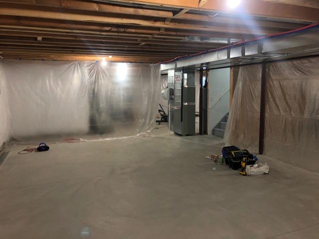 <p>Early in the installation process, the basement is being prepped for the framework for the EverLast Wall Panels that will be installed around the exterior of the finished area of the basement as well as to divide the basement into finished and unfinished halves.</p>