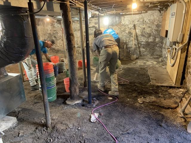 Our team started digging the floor down in order to make way for our SmartJack support systems with pre-cast footings, new waterproofing system and new concrete slab.