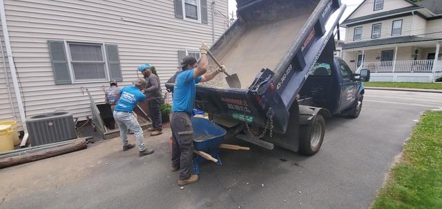 Getting the last of the gravel out of the dump truck