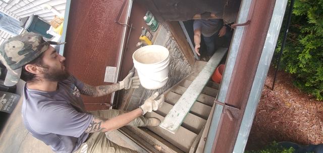 To make the lowering clearing of buckets quicker and more efficient we established an assembly line to bring them down and up from the basement.