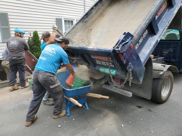 Before laying our new concrete slab we placed gravel with drain mat on the floor in order to create a path of least resistance in order to pitch any and all water towards our waterproofing system