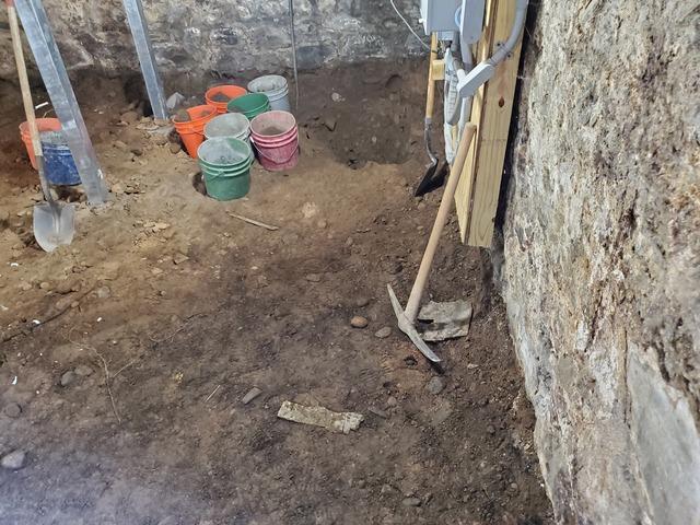 We continued to dig the the basement down to the proper height for our new concrete slab with waterproofing system on the left side of the basement.