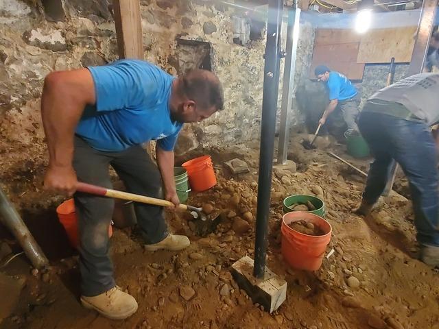 Once the floor was dug down to the proper height we turned our attention to digging out the old lally columns to make way for our SmartJack support systems with pre-cast footings.