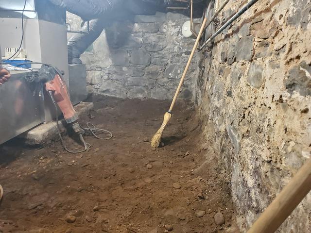 We continued to dig the the basement down to the proper height for our new concrete slab with waterproofing system on the left side of the basement