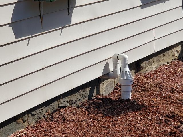 Once we established our discharge line inside the home from the sump pump we attached our IceGuard system and continued to run the discharge line to its final destination.