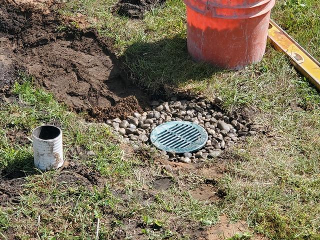 After completing our project we put the finishing touches on the discharge line in their yard.