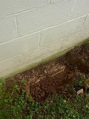 Our BSWV crews installed nin hydraulically-driven Push Piers under the garage in order to stabilize the settling area.