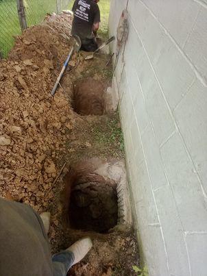 Our BSWV crews installed nin hydraulically-driven Push Piers under the garage in order to stabilize the settling area.