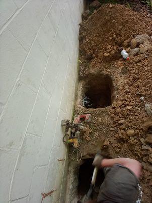 Our BSWV crews installed nin hydraulically-driven Push Piers under the garage in order to stabilize the settling area.