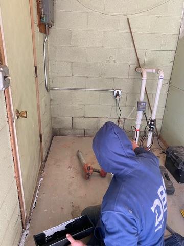 Here, our crew is finishing the job by filling the seam between the slab and foundation wall with NexusPro™. This will prevent water from seeping into the garage via the ground.