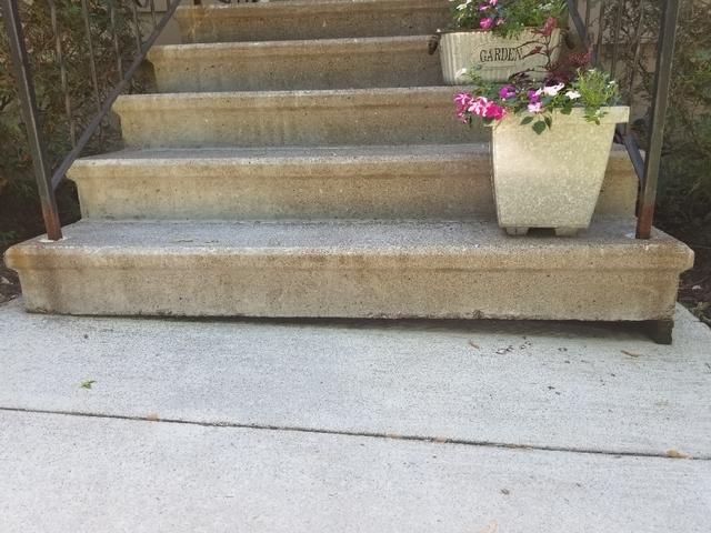 It's easy to see that this front sidewalk is uneven. Soil erosion has caused the right side to sink.