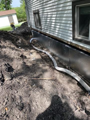 Installation of Drain Tile and SilverGlo Wall Panels