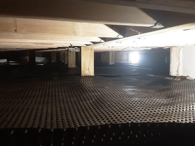 This is the Drainage Matting which directs water to flow to the sump pump where it will be discharged outside the home. The insulation, TerraBlock, goes on top of this and under the liner to keep the home at the correct temperature.