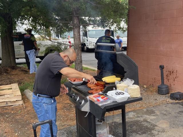 Service Manager Ariel Campos grilling